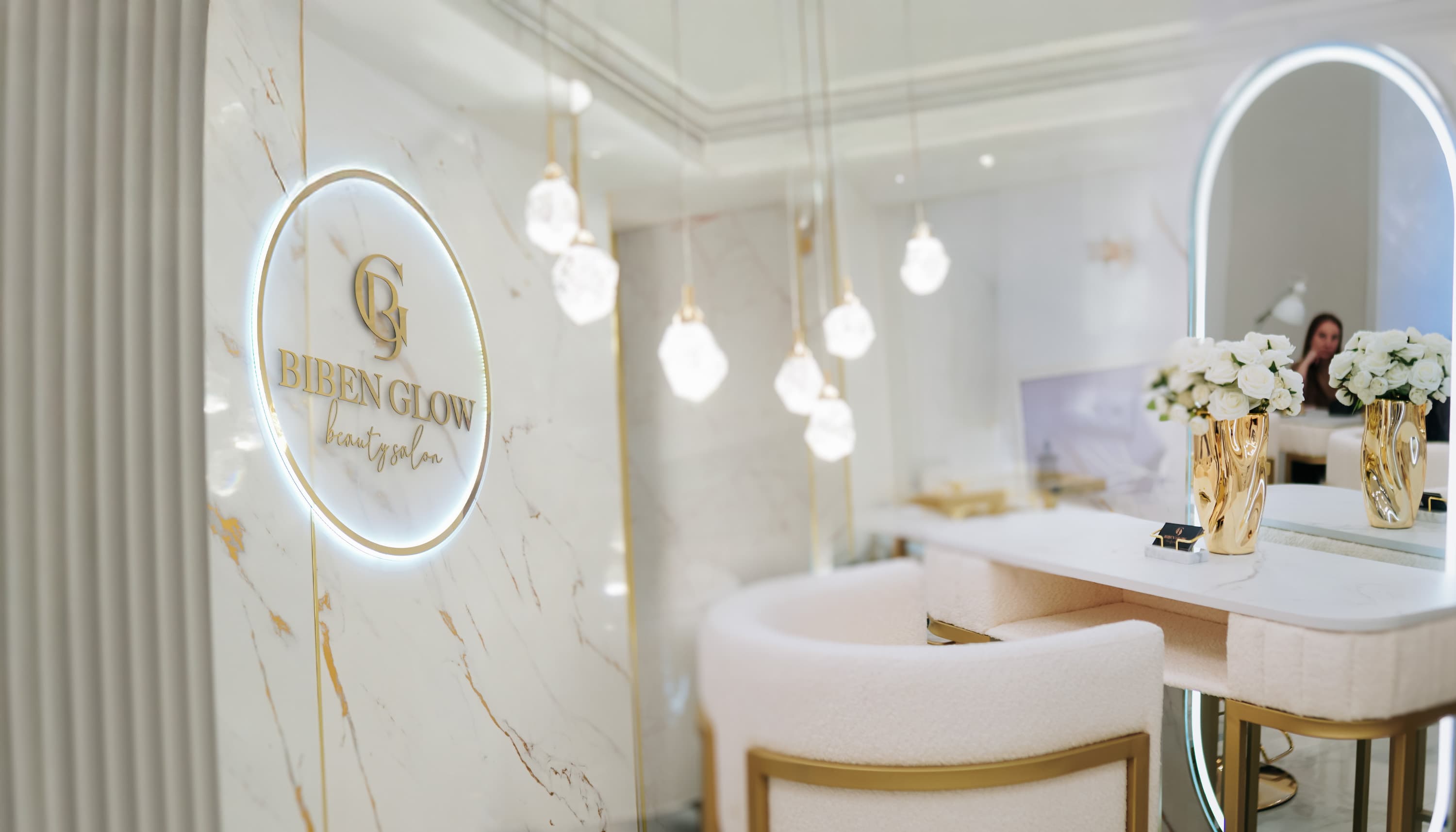 BIBEN GLOW — salon interior with gold logo on marble wall